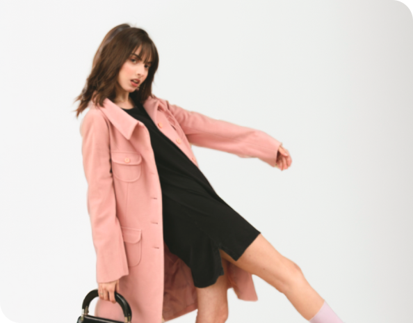 A pink coat on an AI-generated model in studio-themed background